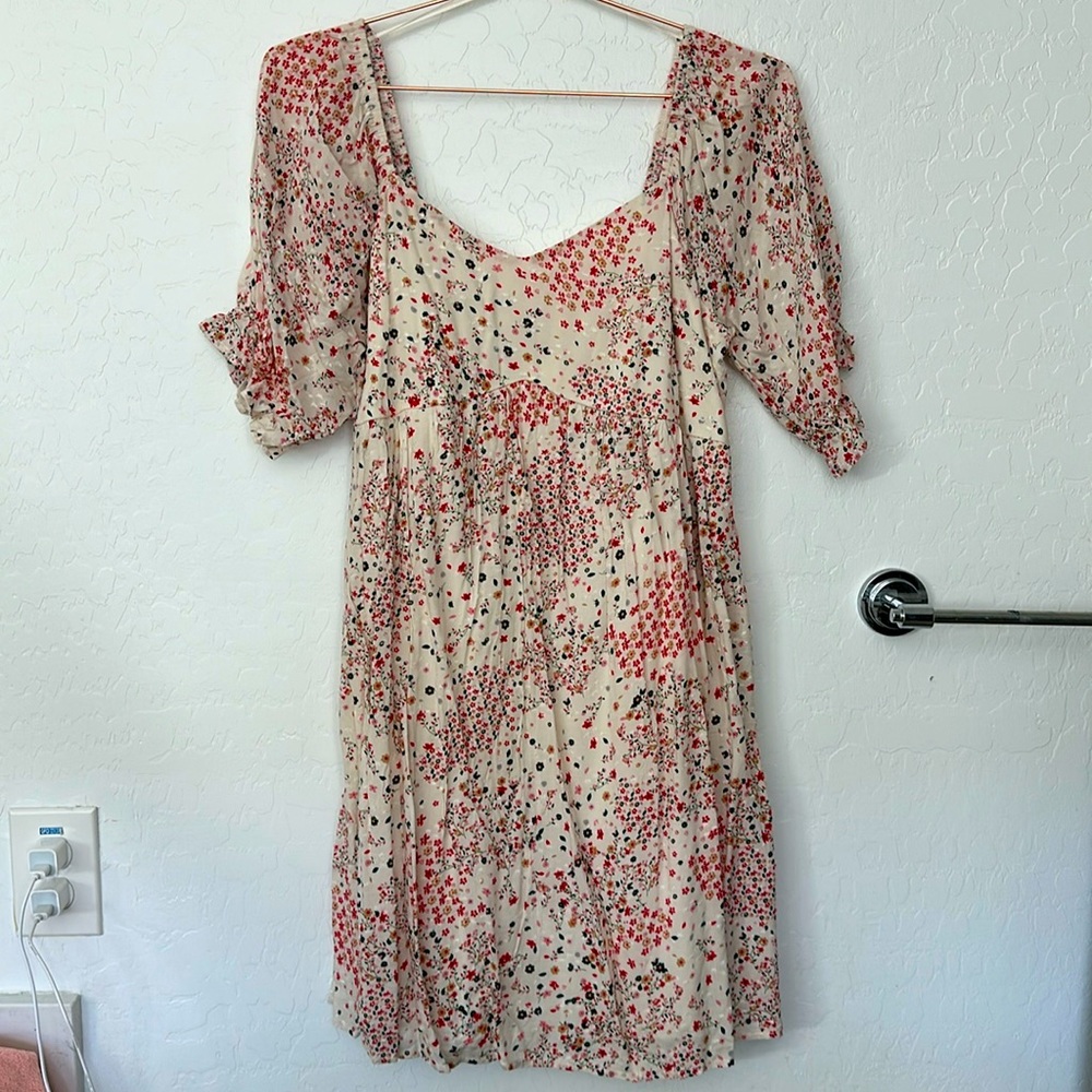 Floral knee length dress. Perfect for spring! New with tags.